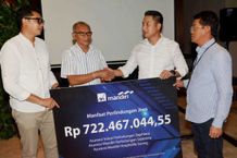 AXA Mandiri Bayar Klaim Tiga Polis Senilai Rp722,47 Juta untuk Nasabah di Denpasar axa mandiri