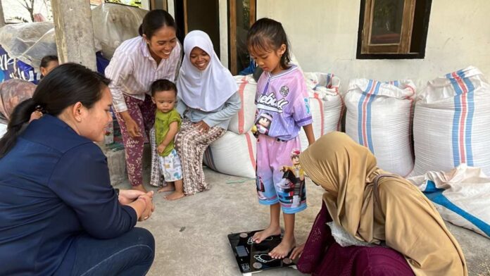 BaliPortalNews_ Lelang MotoGP ITDC Salurkan Hasil Lelang Amal MotoGP 2025 untuk Pencegahan Stunting di Desa Rembitan, Monitoring Awal Tunjukkan Indikasi Perbaikan Gizi
